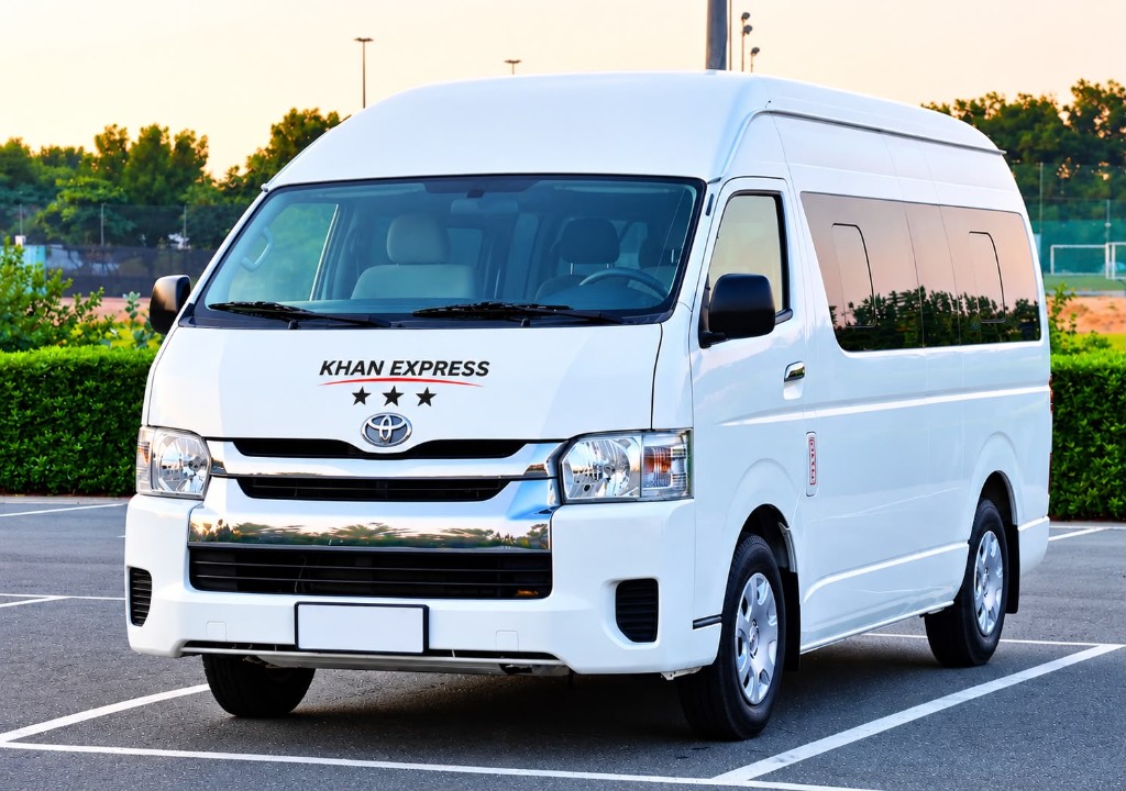 Khan Express branded HiAce van used for car lift and staff transport in Dubai